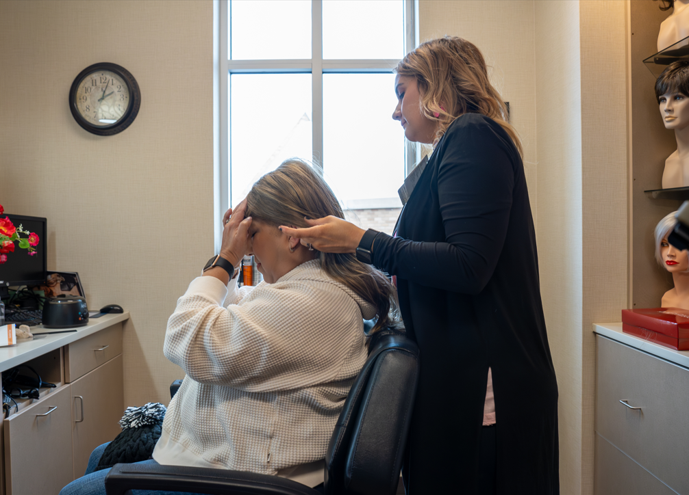 Patient getting fitted for a free wig